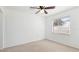 Minimalist bedroom with neutral carpet and a window providing natural light at 2312 Java Plum Ave, Sarasota, FL 34232