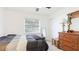 Cozy bedroom featuring a wooden dresser and neutral tones, creating a relaxing atmosphere at 2312 Java Plum Ave, Sarasota, FL 34232