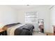 Bedroom with a large window providing natural light at 2312 Java Plum Ave, Sarasota, FL 34232