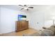 Bedroom featuring dark wood dresser and flat screen tv at 2312 Java Plum Ave, Sarasota, FL 34232