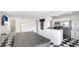Open-concept kitchen with stainless steel appliances and a stylish black and white checkered floor at 2312 Java Plum Ave, Sarasota, FL 34232