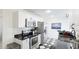 Modern kitchen featuring stainless steel appliances and sleek black countertops at 2312 Java Plum Ave, Sarasota, FL 34232