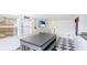 Spacious living room with modern furniture and black and white checkered floors at 2312 Java Plum Ave, Sarasota, FL 34232