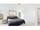 Bright bedroom with vaulted ceiling, large windows, and a comfortable king-size bed at 2312 Java Plum Ave, Sarasota, FL 34232