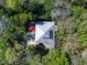 Aerial view of secluded home nestled in lush greenery with unique roofline at 2613 Temple St, Sarasota, FL 34239