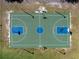 Aerial view of the community's outdoor basketball court featuring modern lighting for nighttime use at 2613 Temple St, Sarasota, FL 34239