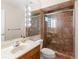 Bathroom featuring a glass-enclosed shower, and a vanity with a marble countertop at 2613 Temple St, Sarasota, FL 34239
