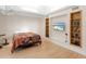 Bedroom features custom built-ins, a TV, and neutral decor at 2613 Temple St, Sarasota, FL 34239