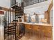 Open concept kitchen with island seating, gas cooktop, and stainless appliances adjoining the living room at 2613 Temple St, Sarasota, FL 34239