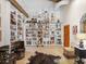 Elegant library with floor to ceiling bookshelves and unique decor at 2613 Temple St, Sarasota, FL 34239