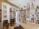 Spacious library with built-in bookshelves, a ladder, and unique decor at 2613 Temple St, Sarasota, FL 34239