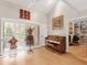 Bright living room featuring a piano, unique decor, and a view to the outside at 2613 Temple St, Sarasota, FL 34239