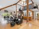 Spacious living room with wooden beams, spiral staircase, and open-concept design at 2613 Temple St, Sarasota, FL 34239