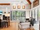 Bright living room features hardwood floors, a fireplace, and sliding glass doors to a balcony at 2613 Temple St, Sarasota, FL 34239