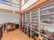 Loft featuring a built-in wall of shelves and an office desk with a window view at 2613 Temple St, Sarasota, FL 34239