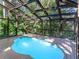 Indoor pool area with a unique glass ceiling, perfect for year-round enjoyment at 2613 Temple St, Sarasota, FL 34239