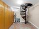 Unique room with a spiral staircase, built in cabinets, and a quirky, eclectic aesthetic at 2613 Temple St, Sarasota, FL 34239