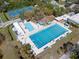 Aerial view showcasing the community's sparkling swimming pools and sunbathing area at 2613 Temple St, Sarasota, FL 34239