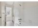 Clean bathroom with a shower and bathtub combo plus white tile walls at 2921 63Rd W St # 2921, Bradenton, FL 34209