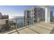 Enjoy breathtaking ocean views from this balcony with glass railings, enhancing the property's appeal with its scenic location at 301 Quay Commons # 1811, Sarasota, FL 34236