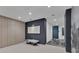 Hallway with bench seating and an accent wall in the condominium lobby at 301 Quay Commons # 1811, Sarasota, FL 34236