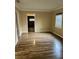 Spacious, bright living room featuring hardwood floors, neutral walls, and a bright window at 3308 W Dewey St, Tampa, FL 33607