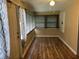 Inviting living room featuring wood floors, neutral walls, and abundant natural light from the window at 3308 W Dewey St, Tampa, FL 33607
