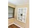 Close up of a unique built-in shelf and modern window with wood blinds and a modern aesthetic at 3308 W Dewey St, Tampa, FL 33607
