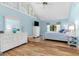 Brightly lit bedroom with high vaulted ceilings, wood floors, and lots of natural light at 3970 Country View Dr, Sarasota, FL 34233