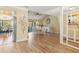 Open-concept dining room with wood floors, bright lighting, and a seamless flow to other living spaces at 3970 Country View Dr, Sarasota, FL 34233