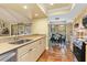 Open kitchen with modern appliances that overlooks the outdoor patio and dining area at 3970 Country View Dr, Sarasota, FL 34233