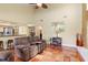 Inviting living room with tile flooring that opens to the kitchen and bar area at 3970 Country View Dr, Sarasota, FL 34233