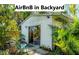 Charming backyard rental cottage surrounded by tropical plants and lush landscaping, great for extra income! at 4062 S Shade Ave, Sarasota, FL 34231