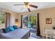 Bedroom with sliding glass doors showcasing the backyard view at 4062 S Shade Ave, Sarasota, FL 34231