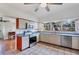 Bright kitchen features stainless steel appliances, large windows, tile floors and plenty of cabinet space at 4062 S Shade Ave, Sarasota, FL 34231
