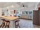 Bright kitchen featuring tile flooring, stainless steel appliances, and a breakfast bar with seating at 4062 S Shade Ave, Sarasota, FL 34231