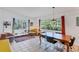 Bright living room with many windows and tile floors at 4062 S Shade Ave, Sarasota, FL 34231