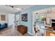 Living Room with tile floors, bright blue walls and natural light at 4062 S Shade Ave, Sarasota, FL 34231