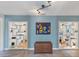 Stylish living room with unique architectural details, decorative shelving, and a colorful tapestry at 4062 S Shade Ave, Sarasota, FL 34231