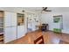 Bright living room with hardwood floors next to a kitchen at 4062 S Shade Ave, Sarasota, FL 34231