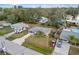 Aerial shot of a single-story home with well-manicured lawn in a quiet residential neighborhood at 4215 Larkin St, Sarasota, FL 34232