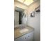 Bathroom featuring a vanity with a granite countertop and a large mirror at 425 30Th W Ave # C210, Bradenton, FL 34205