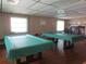 Community game room with multiple pool tables and ample space for recreation at 425 30Th W Ave # C210, Bradenton, FL 34205