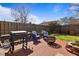 Backyard patio is equipped with a grilling area, fire pit and comfortable seating at 4630 56Th E Dr, Bradenton, FL 34203