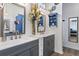 Bright bathroom featuring dual vanities, modern fixtures, and decorative accents, creating a luxurious feel at 4630 56Th E Dr, Bradenton, FL 34203