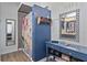 Unique bathroom design featuring a bold blue accent wall, custom shower stall, and decorative vanity at 4630 56Th E Dr, Bradenton, FL 34203