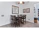 Cozy dining area featuring wood table, stylish light fixture, and neutral decor at 4630 56Th E Dr, Bradenton, FL 34203