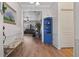 Bright entryway showcasing wood flooring, a blue accent cabinet, and seamless access to living spaces at 4630 56Th E Dr, Bradenton, FL 34203
