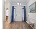 Welcoming entryway with blue-themed decor, a decorative bench, and access to other areas of the home at 4630 56Th E Dr, Bradenton, FL 34203