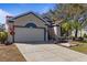 Charming single-story home with a two car garage and well-manicured landscaping at 4630 56Th E Dr, Bradenton, FL 34203